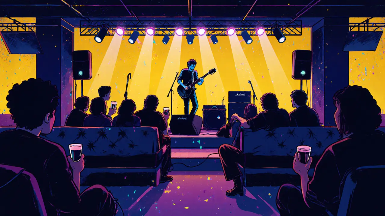 Crowd watching an indie‑rock performance on stage with colorful lights and speakers.